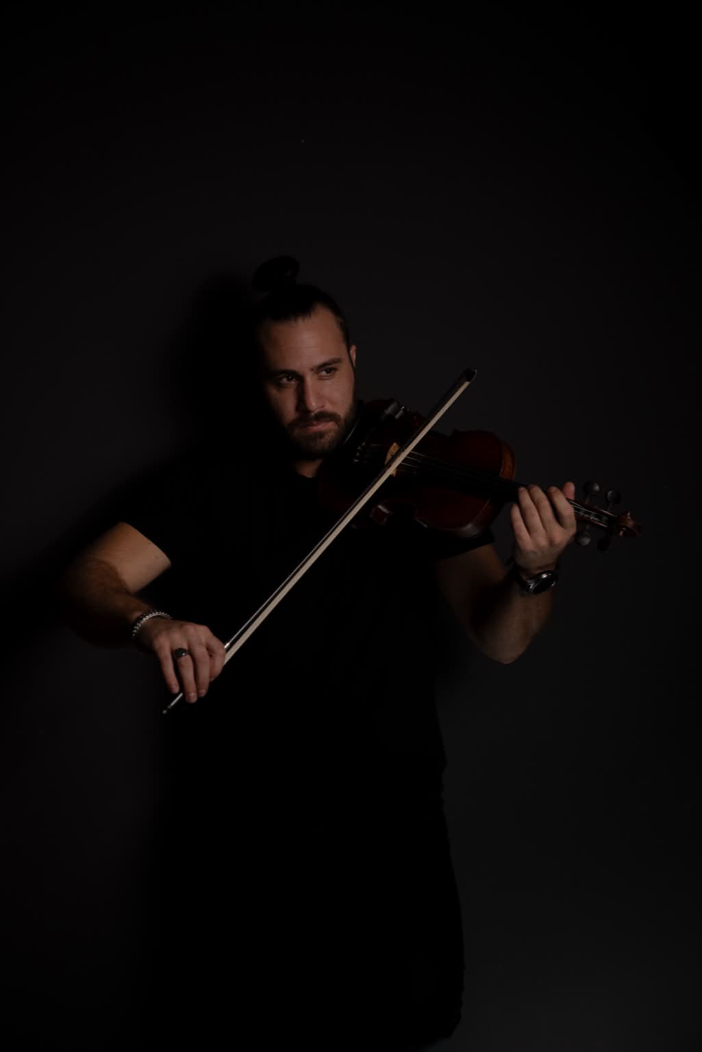 Nick Kouthouris performing violin at venue